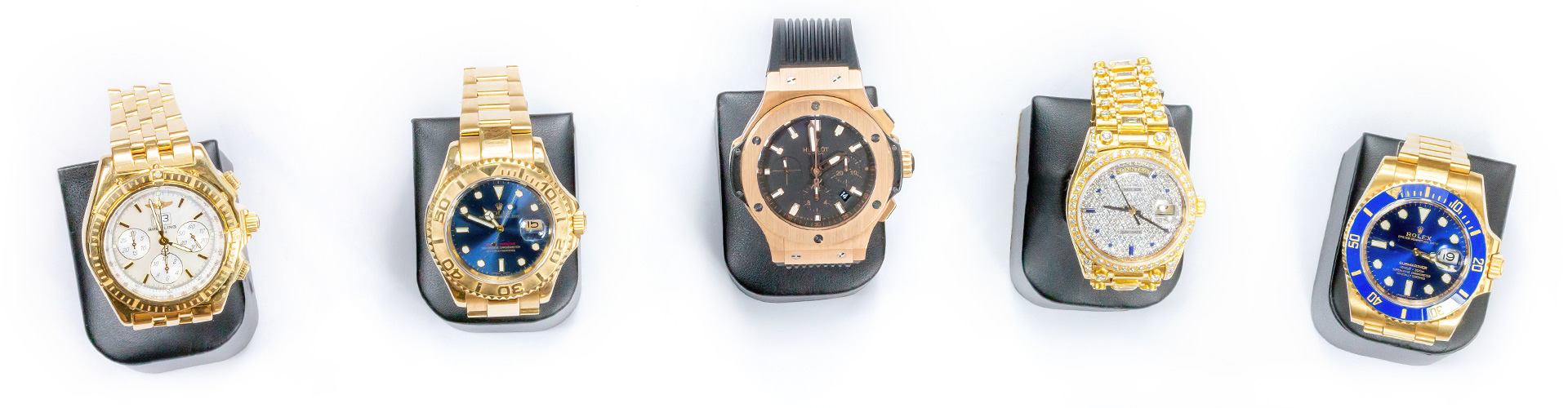 5 goldene Uhren der Marken Rolex, Hublot und Breitling mit unterschiedlich verzierten Lünetten