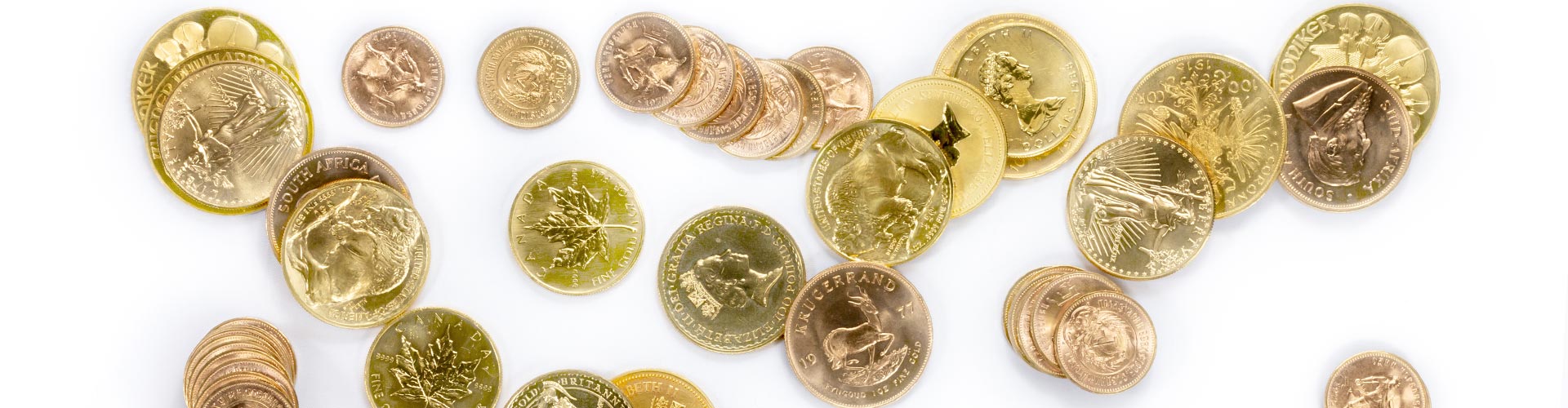 Verschiedene Goldmünzen und Goldanlagemünzen unter anderem Krügerrand, Maple Leaf und Golden Nugget